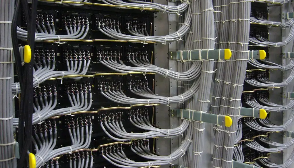Rows of server racks in a data center representing AI inference infrastructure