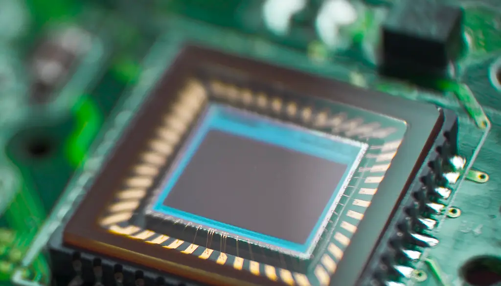 A close-up of a microchip mounted on a circuit board