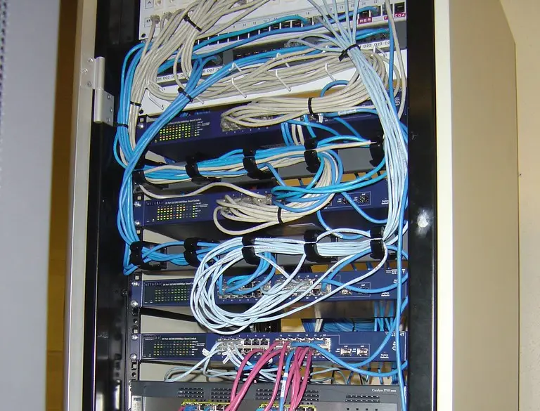 A network firewall appliance mounted in a server rack, the kind of edge device ransomware groups target