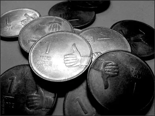 A dollar-pegged coin on a balance scale with a visible crack, representing depeg risk